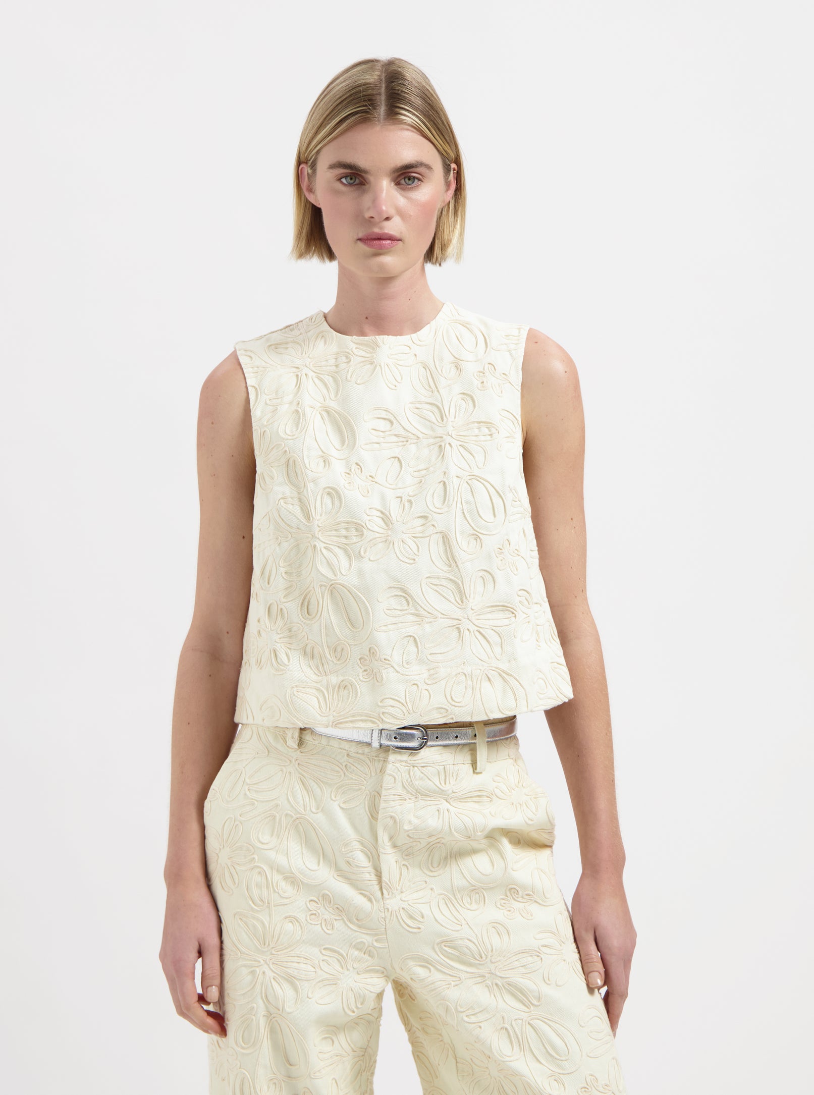 Cream sleeveless textured floral top with round neckline by Nous Sommes Labels