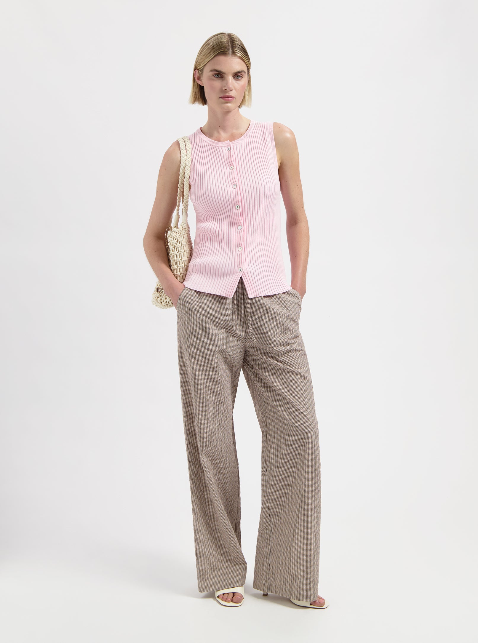 Pink sleeveless knit top with buttons by Nous Sommes Labels