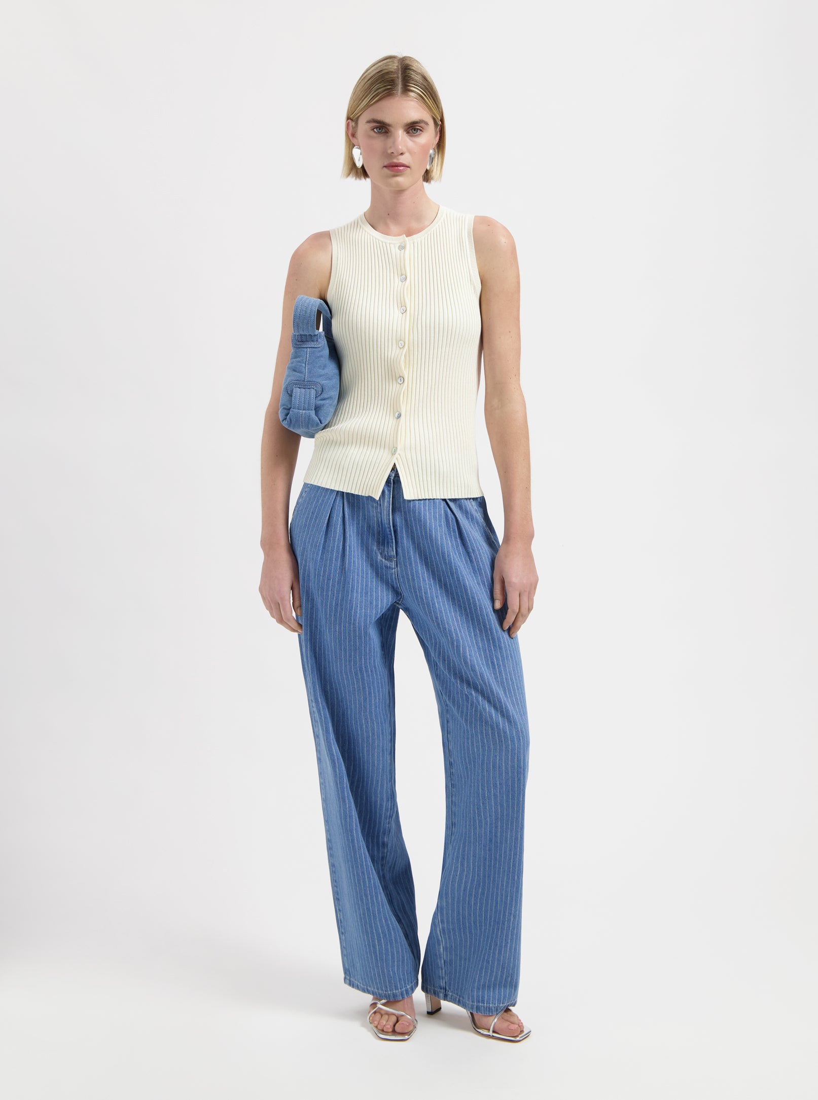 Pink sleeveless knit top with buttons by Nous Sommes Labels