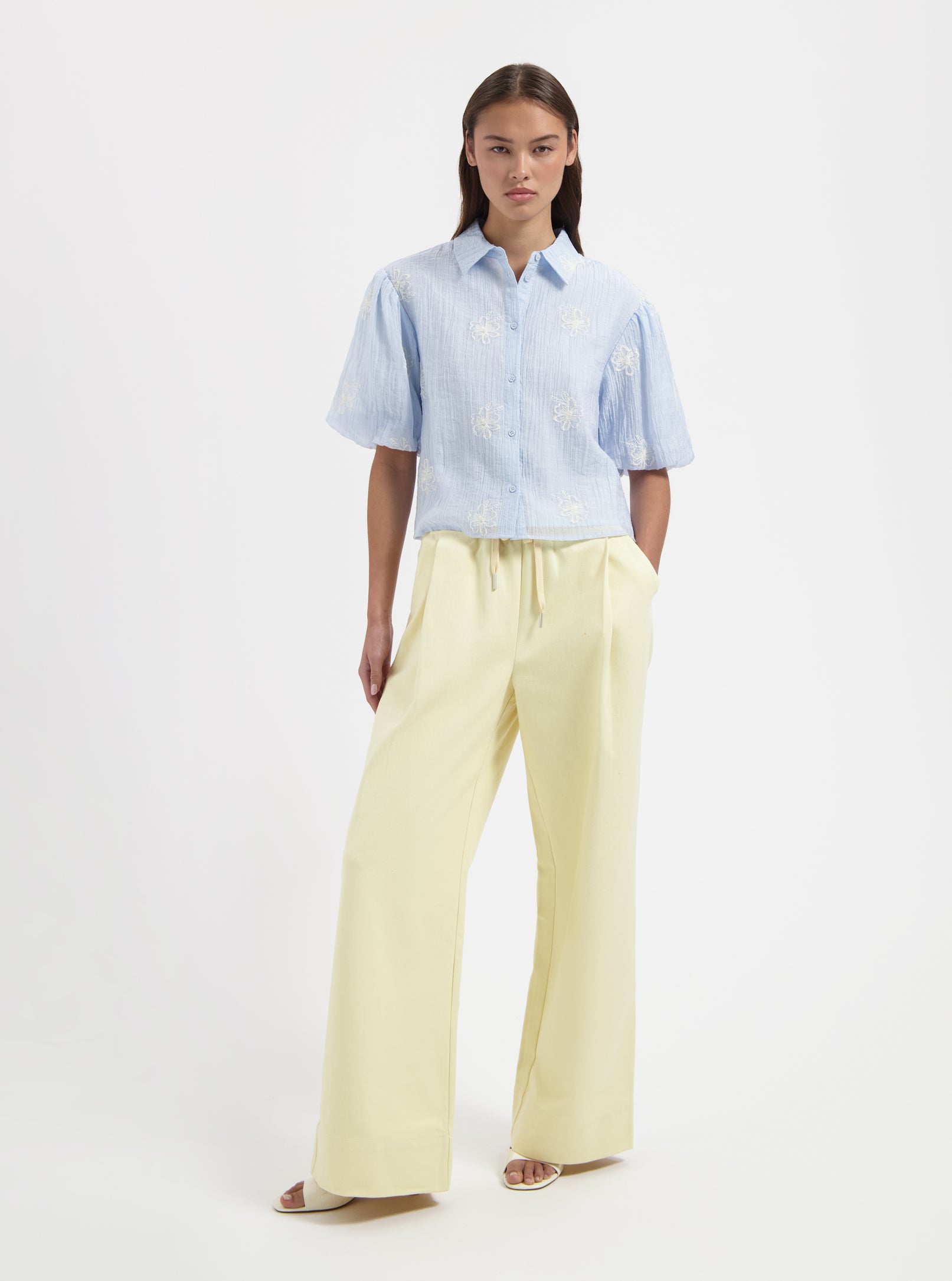 Cropped blue blouse with floral embroidery by Nous Sommes Labels