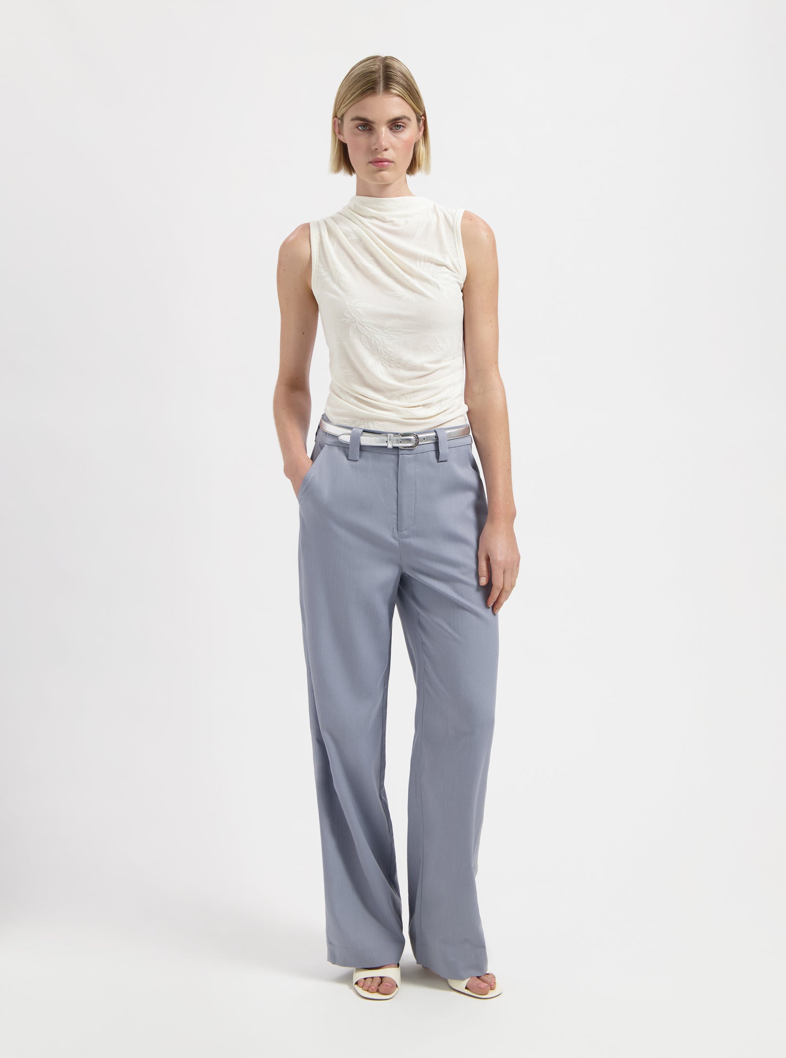 White sleeveless draped top with high neckline by Nous Sommes Labels