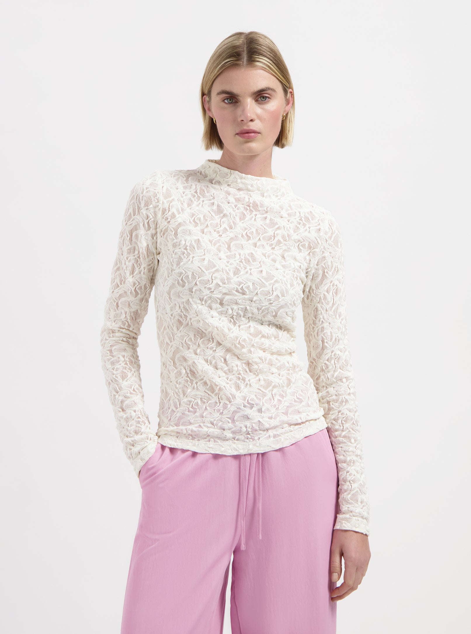 Cream textured long sleeve top with high neckline by Nous Sommes Labels