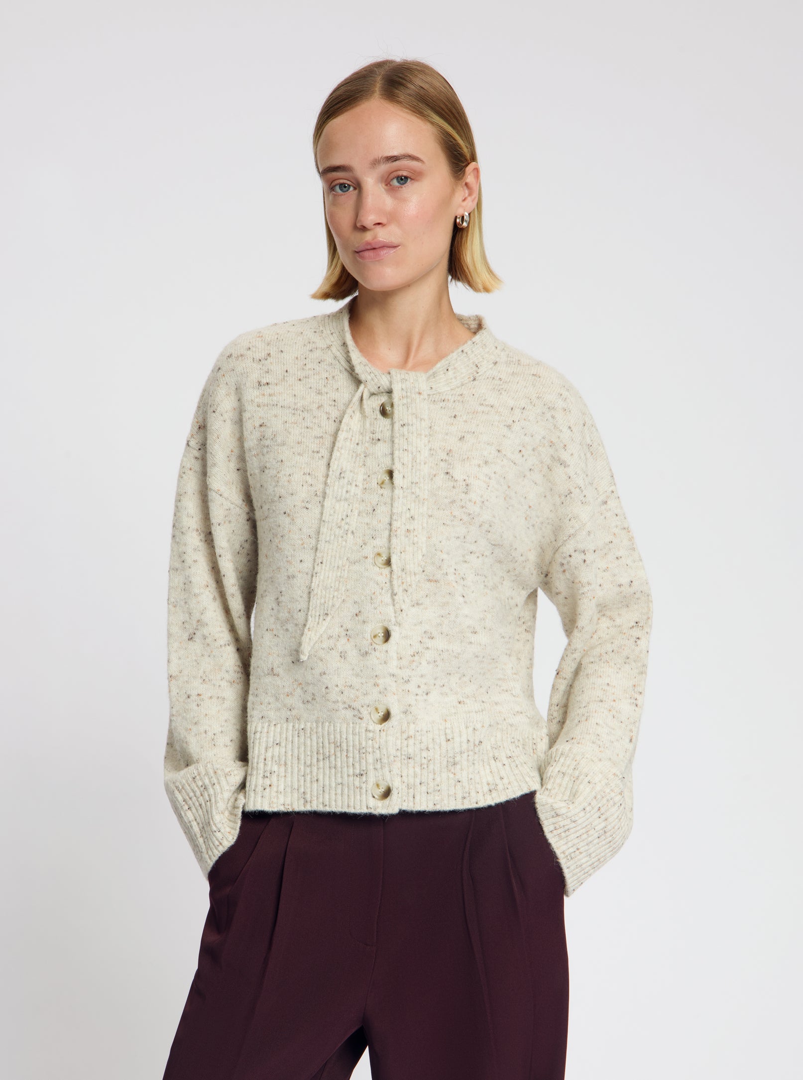 Model wearing the Siri Tie Cardigan in Off White - NOUS SOMMES LABELS