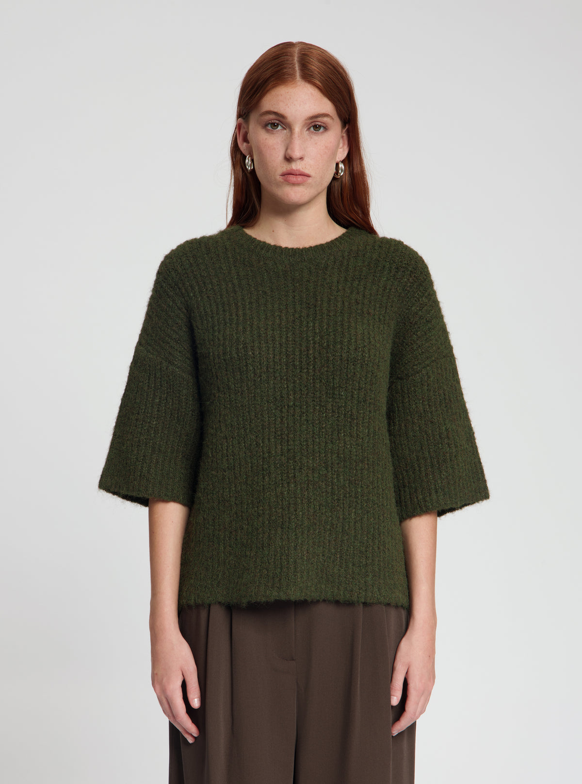 Model wearing Vita pullover in dark olive - NOUS SOMMES LABELS