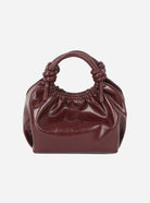 HVISK Jolly Raw Structure bag in deep burgundy - glossy patent leather rounded tote with knotted top handles and ruched drawstring opening