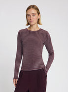 Model wearing Timmie stripe top in burgundy - NOUS SOMMES LABELS
