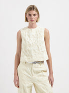 Cream sleeveless textured floral top with round neckline by Nous Sommes Labels 