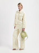 Cream Trucker Jacket with floral embroidery by Nous Sommes Labels 