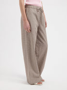 Checked wide leg pants in brown by Nous Sommes Labels 