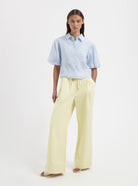 Cropped blue blouse with floral embroidery by Nous Sommes Labels 