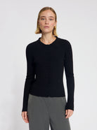 Model wearing the Winnie Polo Knit in Black - NOUS SOMMES LABELS