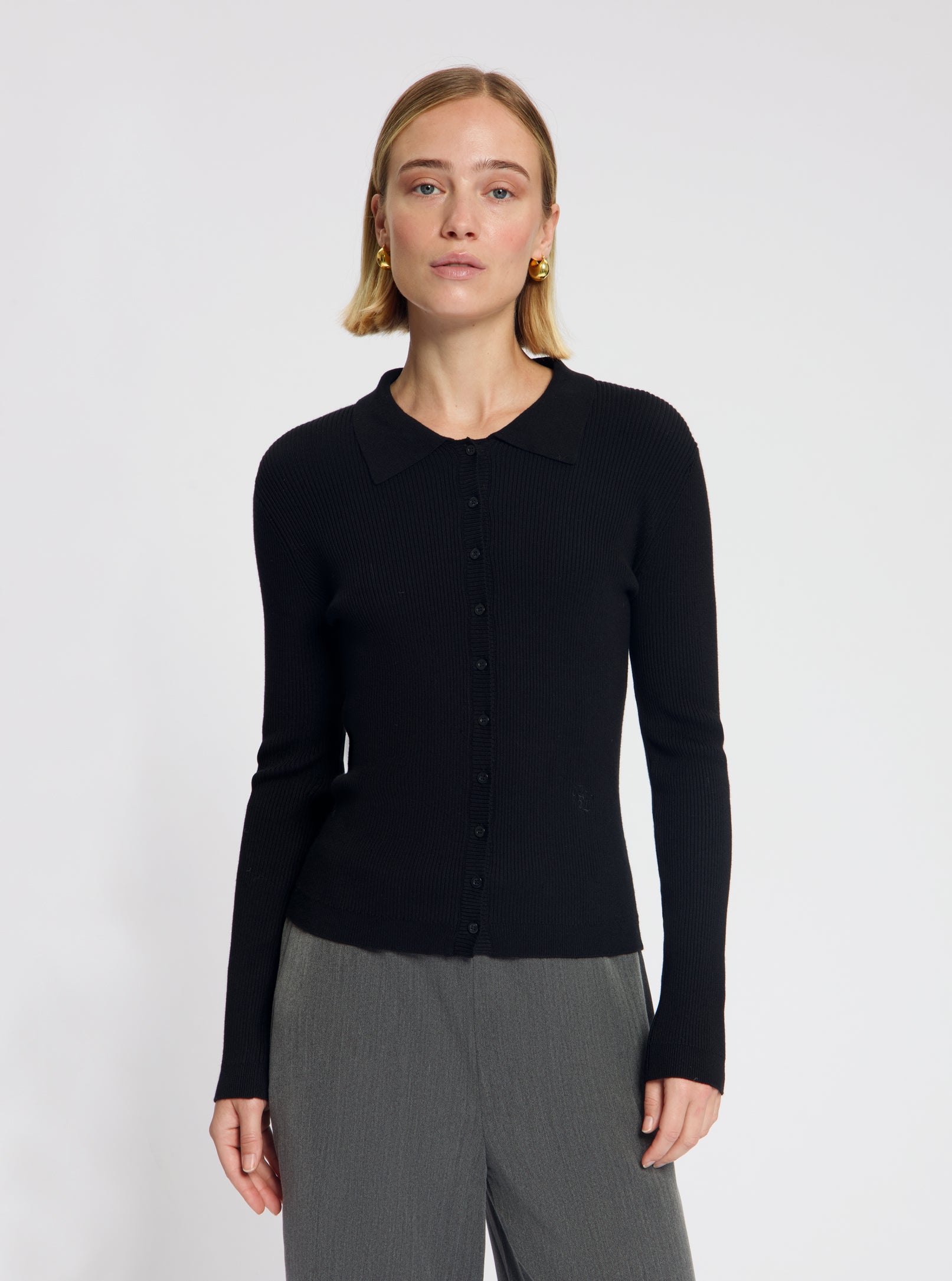 Model wearing the Winnie Polo Knit in Black - NOUS SOMMES LABELS