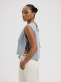 Light blue sleeveless floral print top with side tie details and relaxed fit by Nous Sommes Labels 