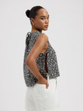 Grey sleeveless floral print top with side tie details and relaxed fit Nous Sommes Labels