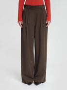 Model wearing Gabbie trousers in brown - NOUS SOMMES LABELS 