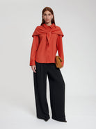 Model wearing Grace blouse in orange - NOUS SOMMES LABELS 