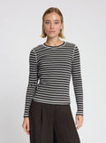 Model wearing Timmie stripe top in black - NOUS SOMMES LABELS 