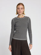 Model wearing Timmie stripe top in black - NOUS SOMMES LABELS 