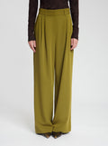 Model wearing Gabbie trousers in dark olive - NOUS SOMMES LABELS 