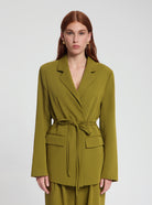 Model wearing Bessie Tie Blazer in dark olive - NOUS SOMMES LABELS
