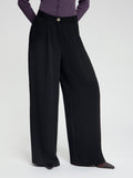 Model wearing high-waisted, wide-leg black Wren trousers - NOUS SOMMES LABELS