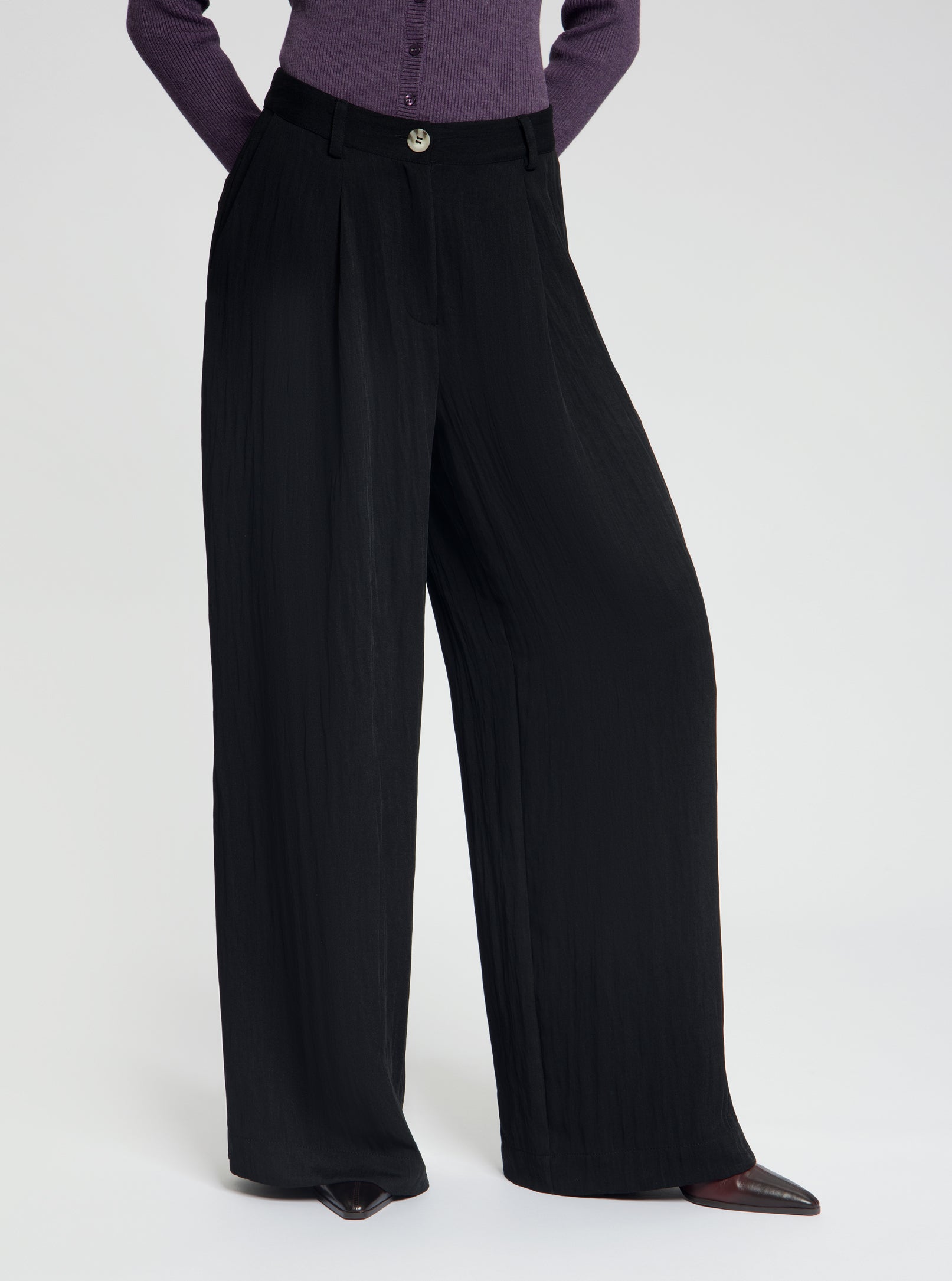 Model wearing high-waisted, wide-leg black Wren trousers - NOUS SOMMES LABELS