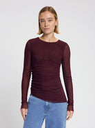 Model wearing the Lila Mesh Top in Burgundy - NOUS SOMMES LABELS