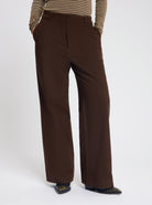 Model wearing the Marggie Trousers in Brown - NOUS SOMMES LABELS